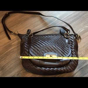 All leather coach bag, chocolate dark brown color. Weave pattern (front)